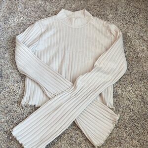 Altar’d state fitted cream top with bell sleeves.  Size xs